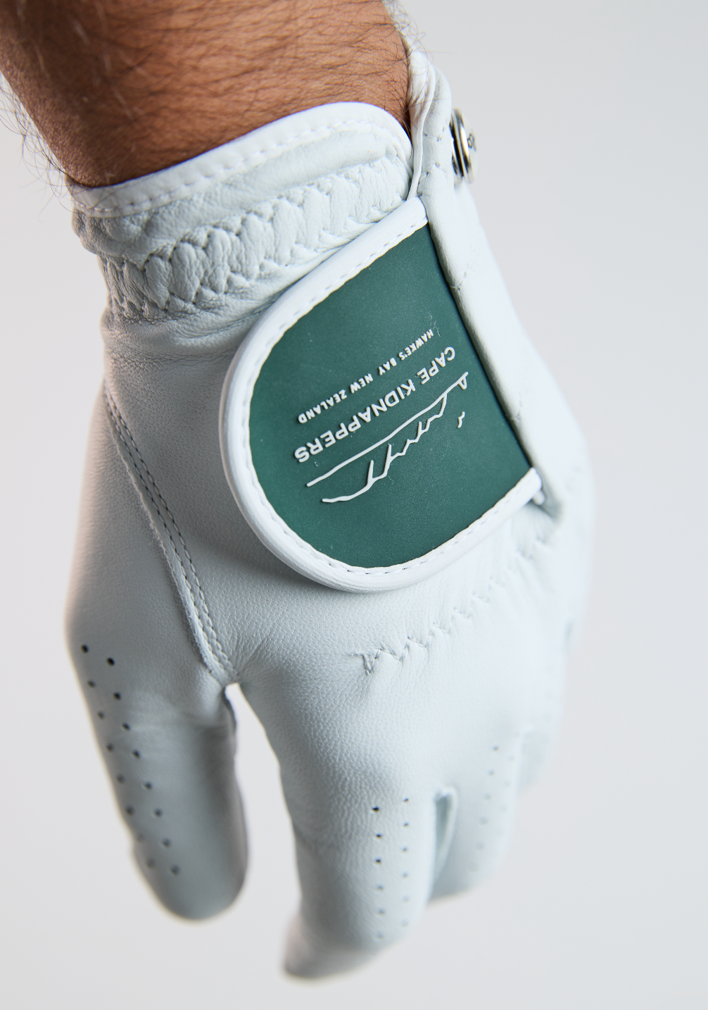 Custom golf glove with premium rubber branded badge