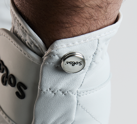 Solos custom golf glove — magnetic ball marker on the closure tab
